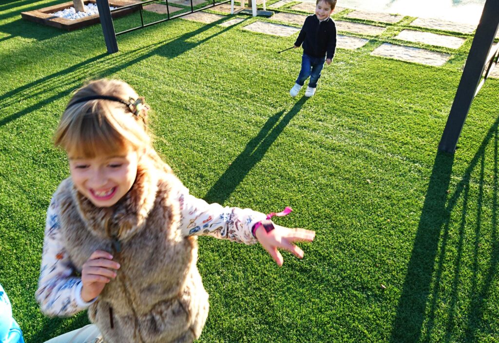 Children playing pilla pilla on the lawn of Albergrass